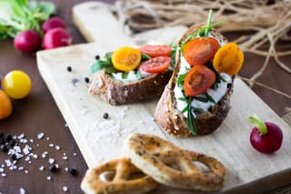 Avocado toast with tomatoes and radishes