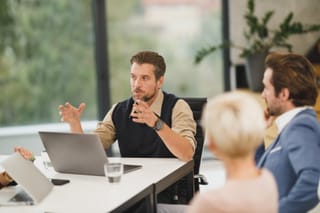 Business team discussion around table