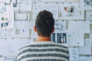 Man reviewing design board