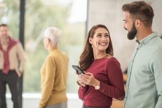 People talking at social gathering
