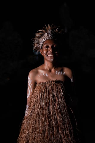 Person in a traditional cultural costume and headpiece.