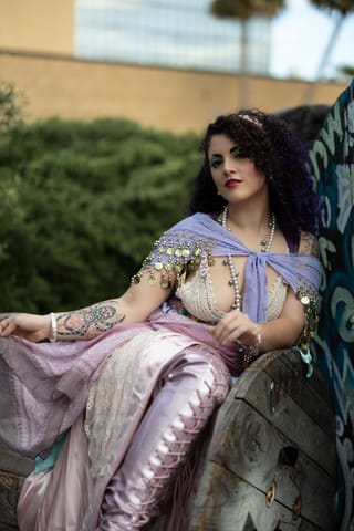 Woman wearing a vintage dress in an outdoor fashion portrait.