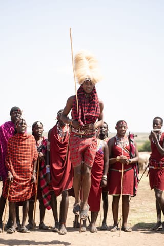 Traditional dance group performing outdoors during a cultural celebration.