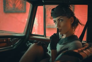 Woman black fashion vintage car interior portrait