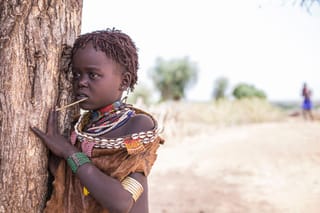 Child traditional jewelry tree outdoor portrait