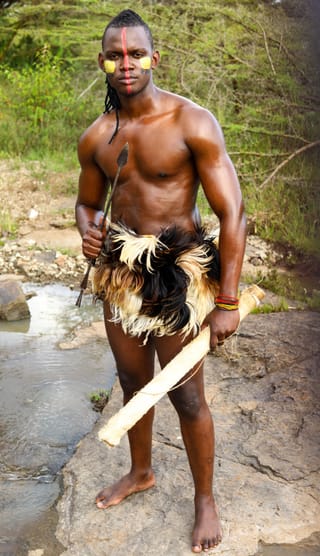 Man traditional warrior outfit sword portrait