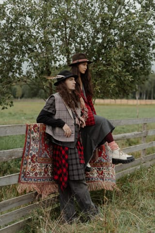 Woman boho fashion countryside fence portrait