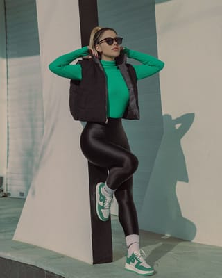 Woman green sweatshirt black leggings streetwear