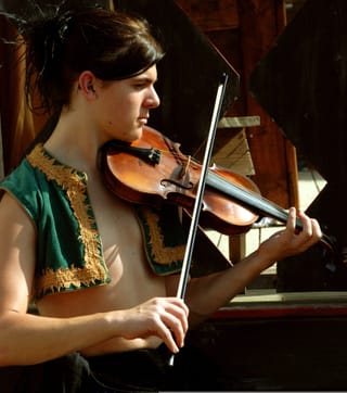 Woman playing violin musician portrait