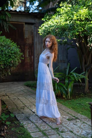 Woman white summer dress garden portrait
