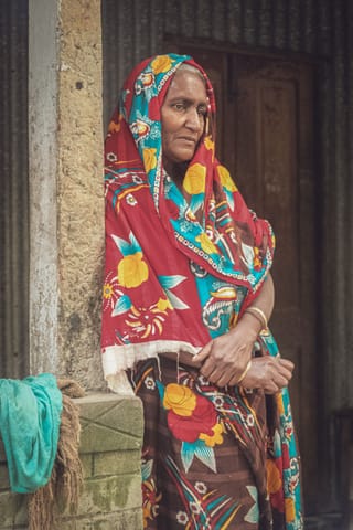 Woman colorful traditional dress doorway