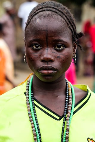 Child beaded necklace cultural portrait