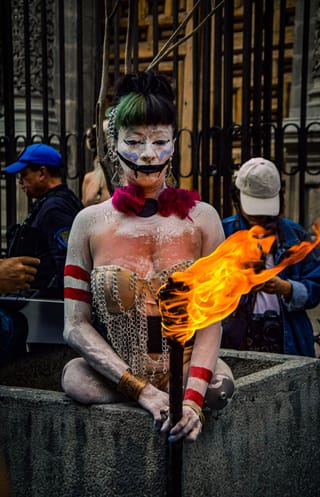 Woman fire performer street festival portrait