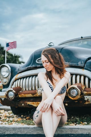 Woman white dress vintage car portrait