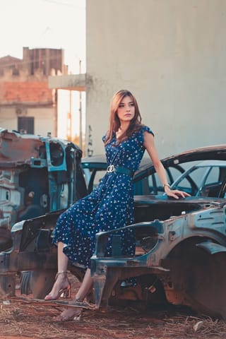 Woman blue polka dot dress classic cars