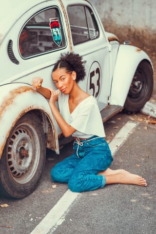 Woman vintage Volkswagen Beetle car portrait