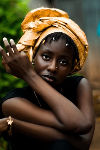 Woman yellow headwrap close up portrait