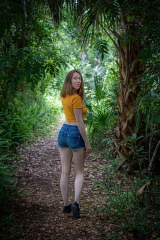 Woman yellow shirt forest trail outdoor