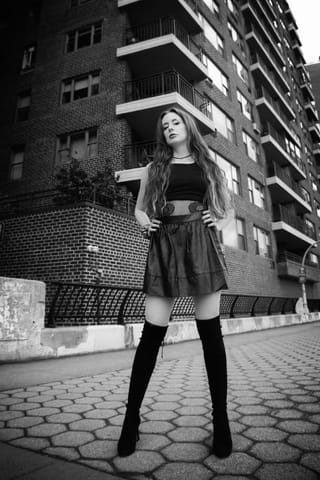 Woman black dress urban city black and white portrait
