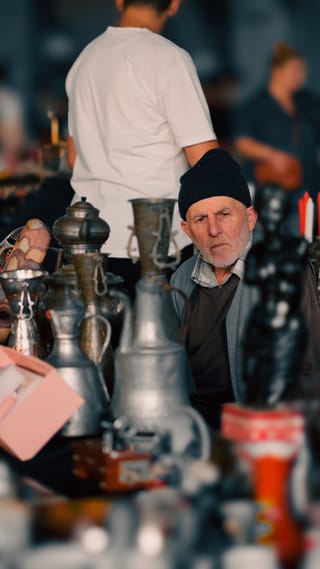 Senior man at a local market during cultural travel.