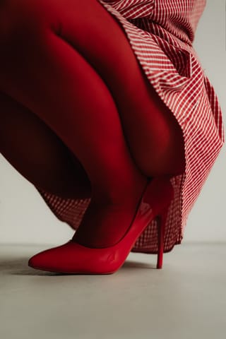 Red tights with red high heels.
