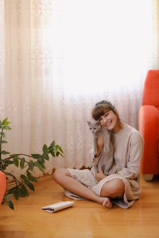 Woman sitting on the floor at home.