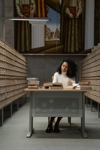 Woman working alone at a modern office desk.