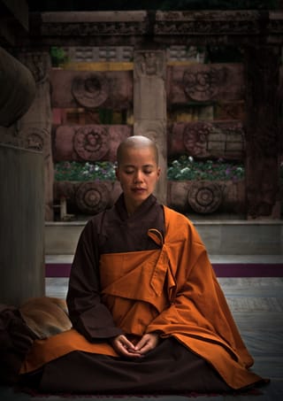 Buddhist monk meditating temple spirituality.