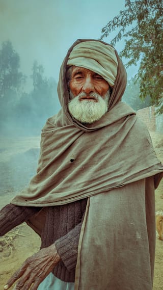 Elderly man turban desert cultural portrait.