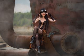 Steampunk woman costume industrial fashion portrait.