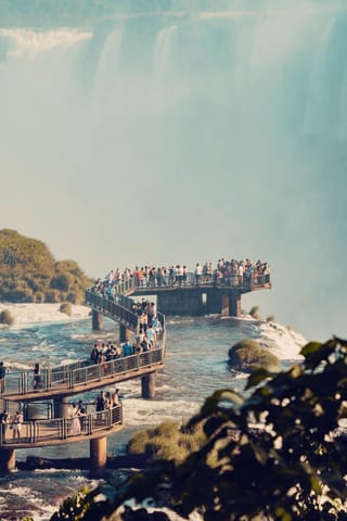 Waterfall viewpoint tourists scenic nature travel.